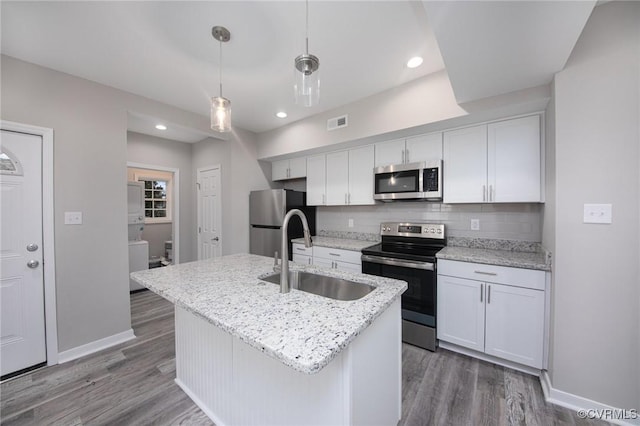 2414 Marion Mashore St, Richmond, VA 23224 - kitchen featuring pendant lighting, sink, white cabinetry, and appliances with stainless steel finishes