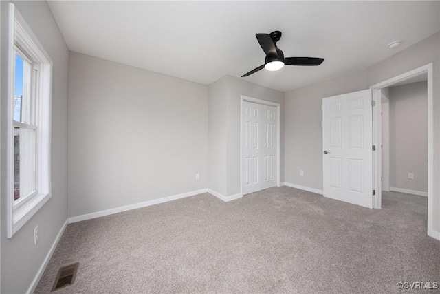 2414 Marion Mashore St, Richmond, VA 23224 - unfurnished bedroom featuring a closet, ceiling fan, and carpet flooring