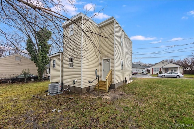 2414 Marion Mashore St, Richmond, VA 23224 - view of front of house with central AC and a front yard