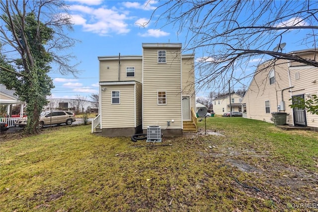 2414 Marion Mashore St, Richmond, VA 23224 - rear view of property with a yard and central air condition unit