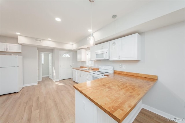 2414 Marion Mashore St, Richmond, VA 23224 - kitchen with white cabinetry, white appliances, decorative light fixtures, and kitchen peninsula