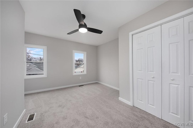 2414 Marion Mashore St, Richmond, VA 23224 - unfurnished bedroom featuring light carpet, a closet, and ceiling fan