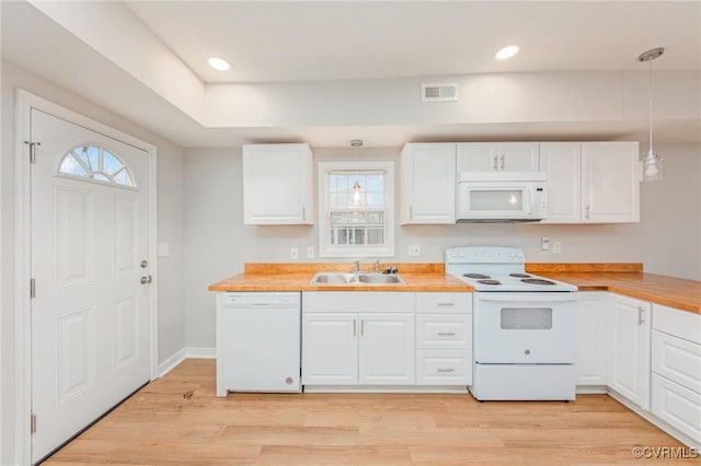 2414 Marion Mashore St, Richmond, VA 23224 - kitchen with pendant lighting, white appliances, sink, and white cabinets