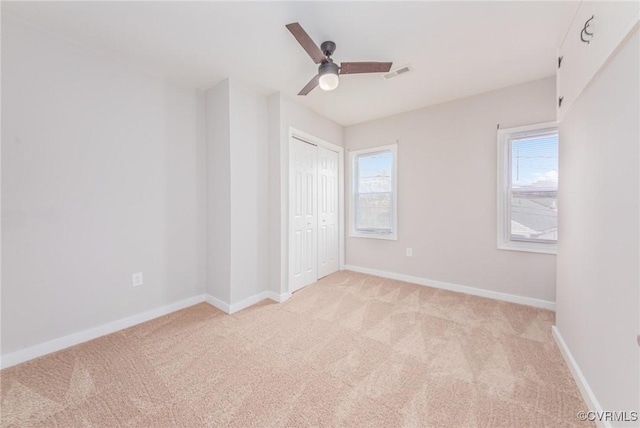2414 Marion Mashore St, Richmond, VA 23224 - unfurnished bedroom with ceiling fan, a closet, and light carpet