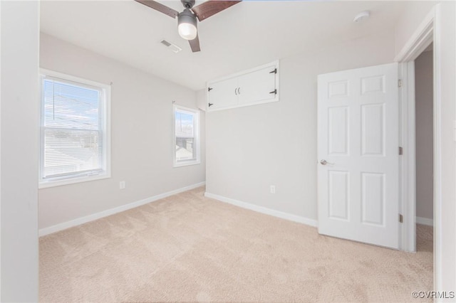 2414 Marion Mashore St, Richmond, VA 23224 - spare room featuring light colored carpet and ceiling fan