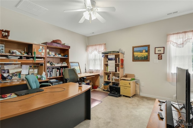 office area featuring light colored carpet and ceiling fan