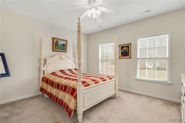 bedroom with light carpet and ceiling fan