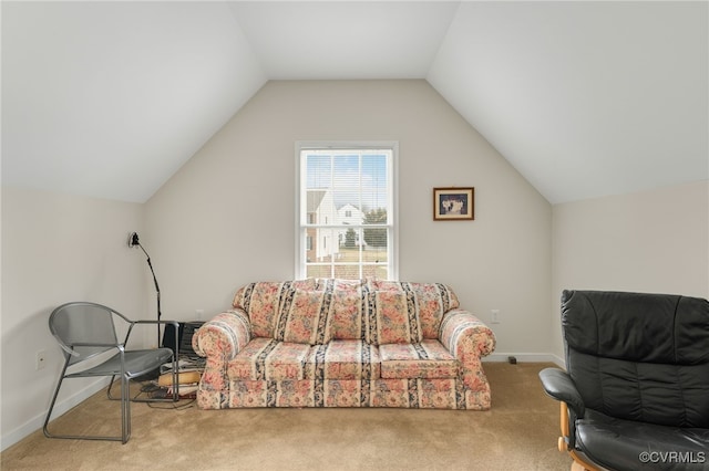 living area featuring carpet and lofted ceiling