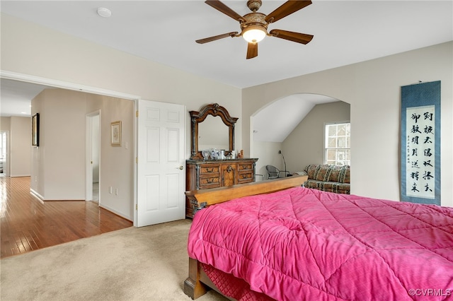 carpeted bedroom with lofted ceiling and ceiling fan