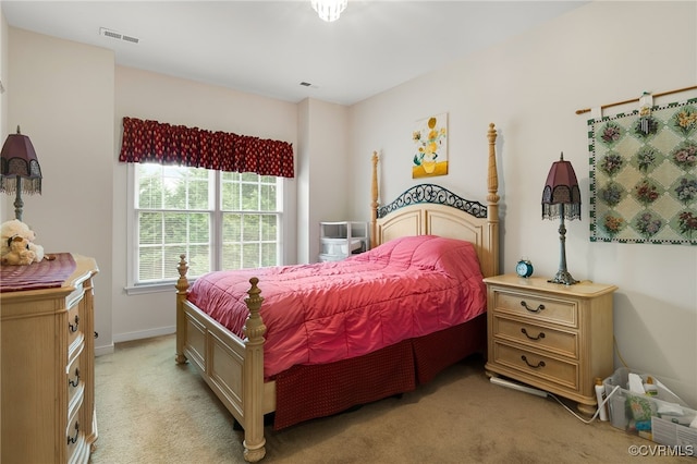 bedroom with light colored carpet