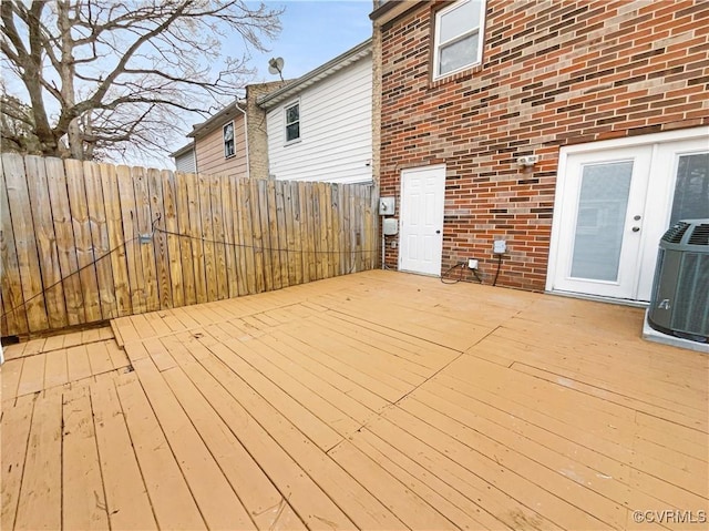 wooden deck featuring french doors and central air condition unit