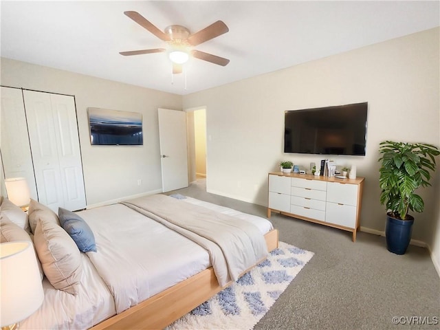 carpeted bedroom featuring ceiling fan and a closet