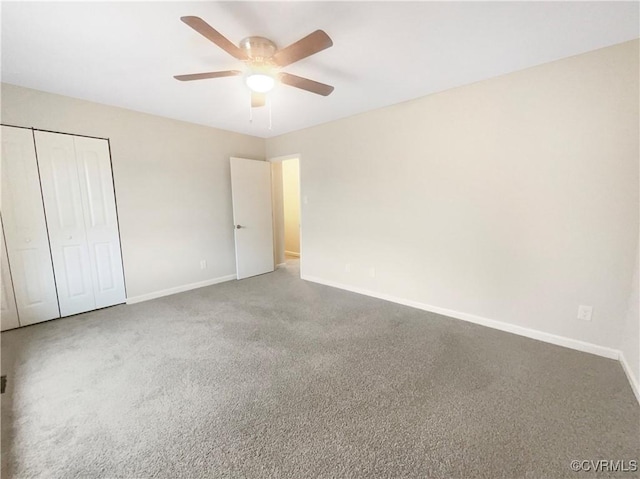 unfurnished bedroom featuring carpet floors, a closet, and ceiling fan