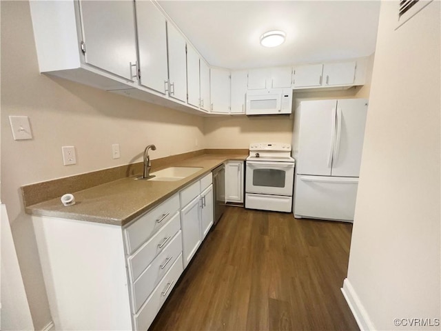 kitchen featuring white cabinetry, sink, white appliances, and dark hardwood / wood-style floors