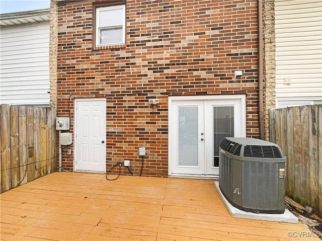 interior space featuring french doors and central air condition unit