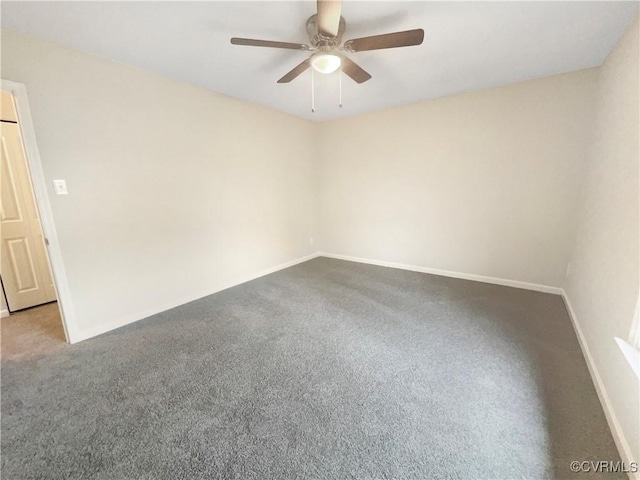 spare room with carpet floors and ceiling fan