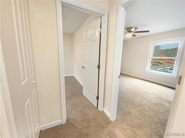 corridor with light colored carpet