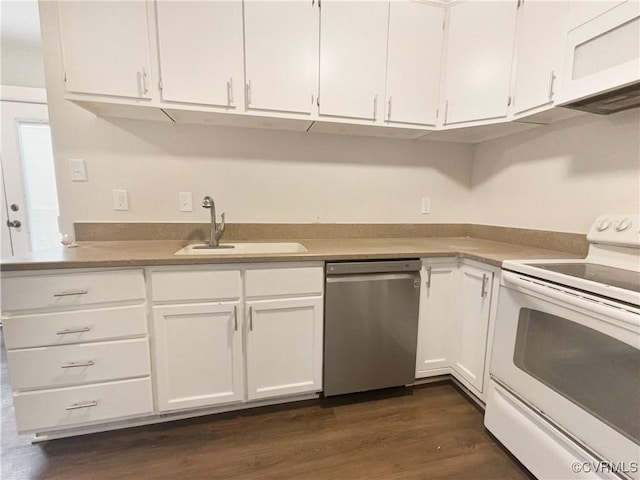 kitchen with white appliances, dark hardwood / wood-style floors, sink, and white cabinets