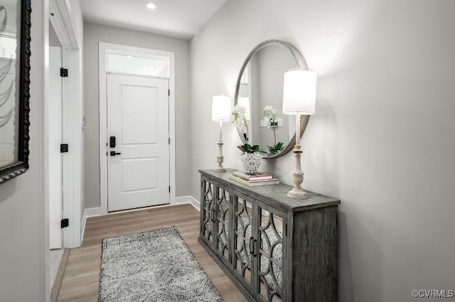 doorway to outside featuring light hardwood / wood-style flooring