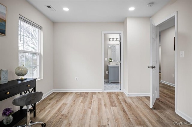 home office featuring light hardwood / wood-style floors