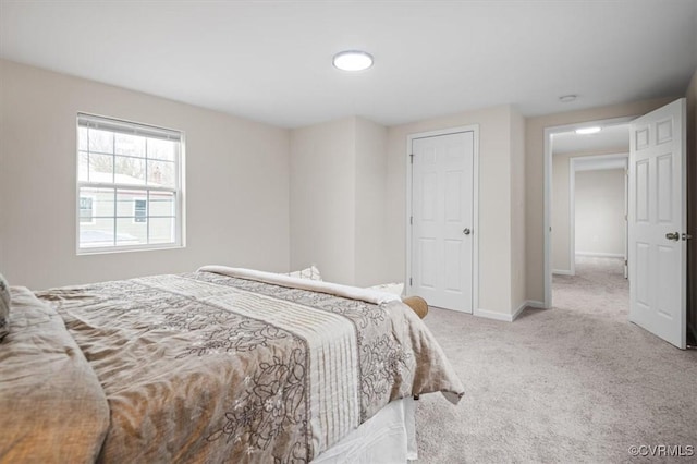 bedroom featuring light carpet