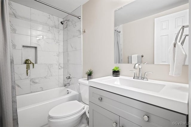 full bathroom with vanity, shower / tub combo, and toilet