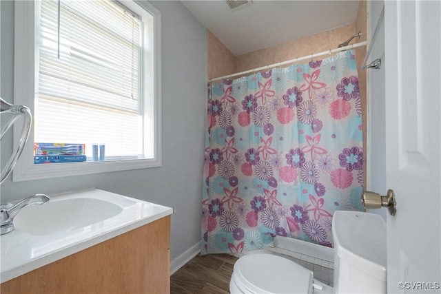 bathroom featuring vanity, hardwood / wood-style flooring, toilet, and a shower with shower curtain