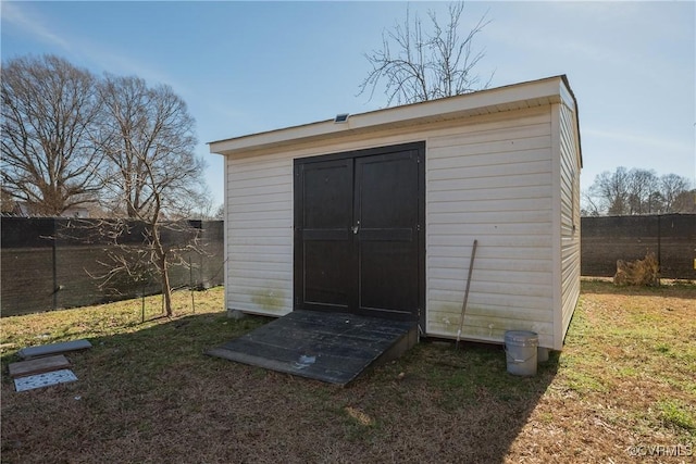 view of outbuilding with a lawn