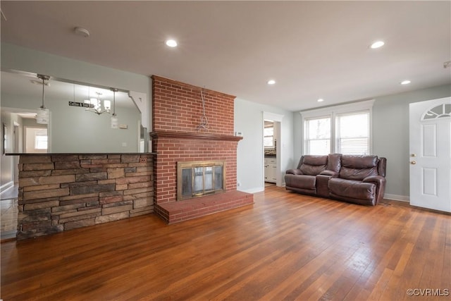 living room featuring a fireplace and wood-type flooring