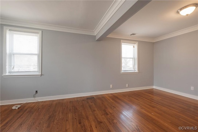 spare room featuring ornamental molding and wood-type flooring