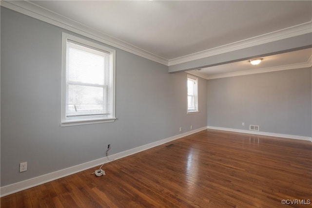 spare room with crown molding and dark hardwood / wood-style floors