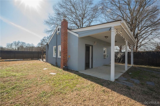 view of property exterior featuring a patio, a yard, and cooling unit