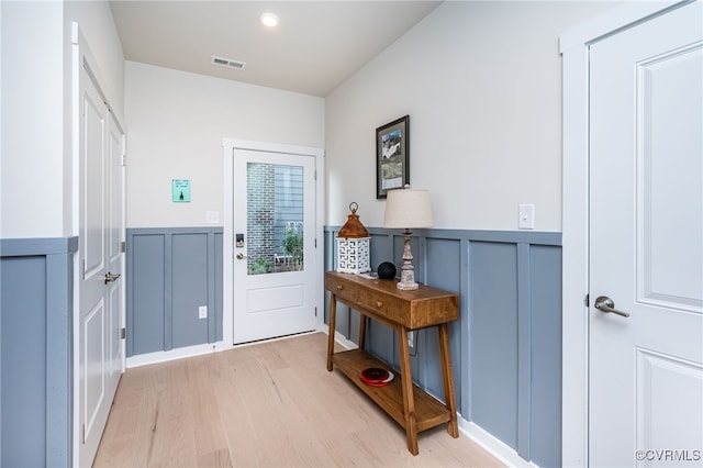 entryway with light hardwood / wood-style flooring