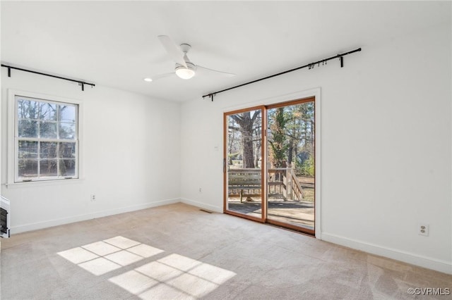 carpeted empty room with ceiling fan