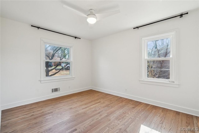 unfurnished room featuring light hardwood / wood-style floors and ceiling fan