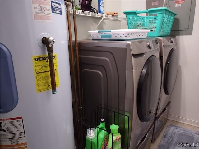 clothes washing area featuring independent washer and dryer and water heater