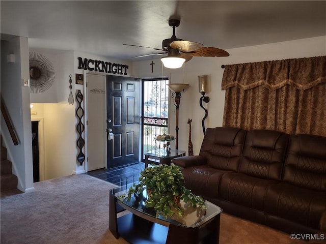 living room featuring carpet floors and ceiling fan