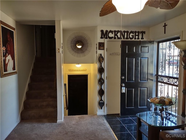 tiled entrance foyer with ceiling fan