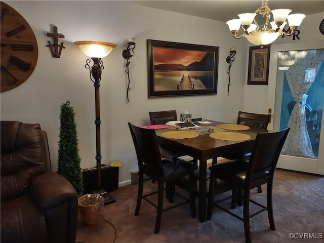 carpeted dining area featuring an inviting chandelier