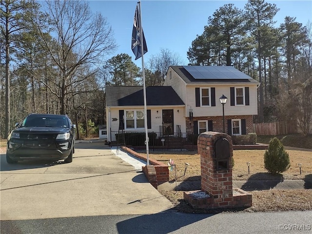 view of front of house featuring solar panels