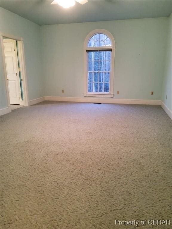 empty room featuring carpet flooring