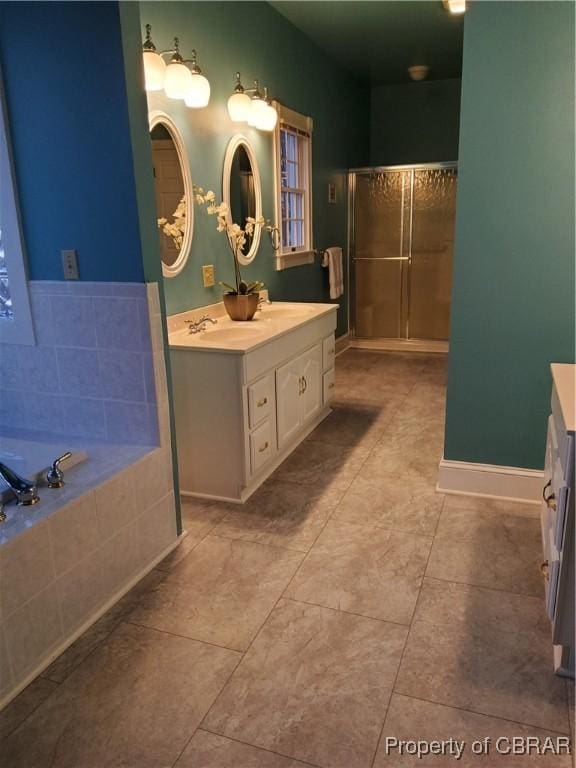 bathroom featuring vanity, tile patterned floors, and shower with separate bathtub