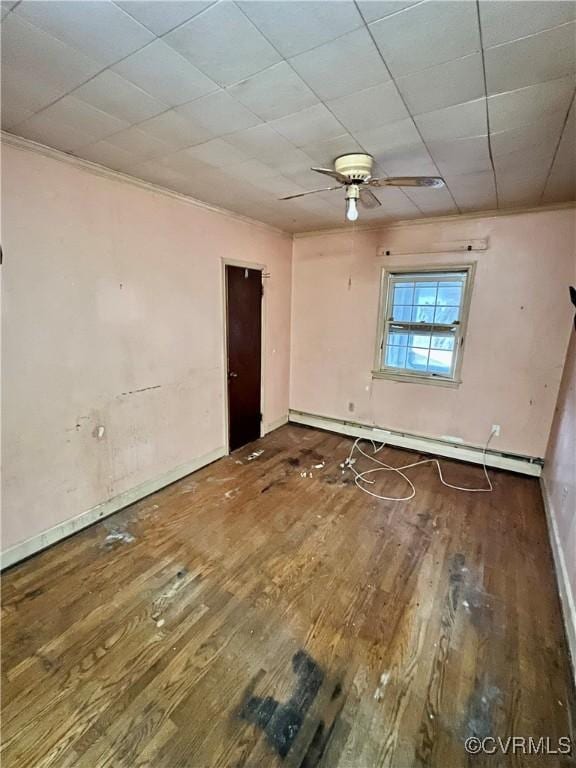 unfurnished room featuring hardwood / wood-style flooring, ceiling fan, and baseboard heating