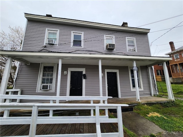 farmhouse with cooling unit and covered porch