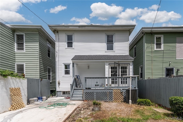 rear view of property with a deck