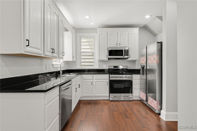 kitchen featuring white cabinetry, appliances with stainless steel finishes, and sink