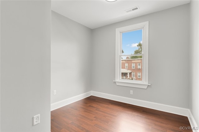 unfurnished room featuring hardwood / wood-style floors