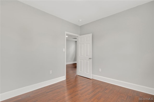 unfurnished room featuring dark hardwood / wood-style floors