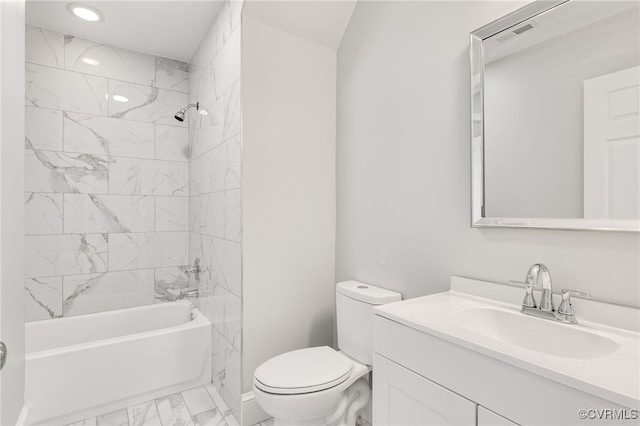 full bathroom featuring vanity, toilet, and tiled shower / bath combo