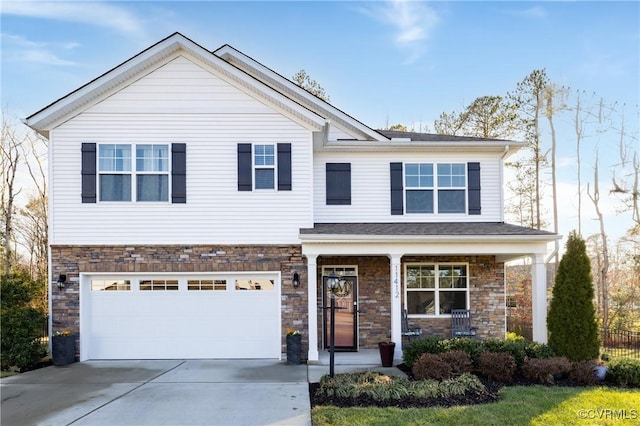 view of front of property with a garage and a porch